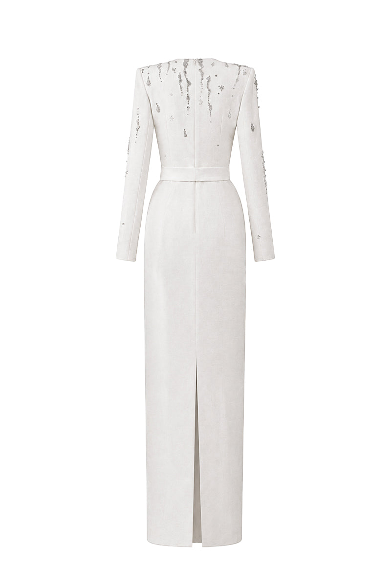 White embellished V-neck column gown by I.H.F featuring flowing water effect embellishments and elegant crepe fabric.