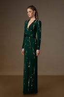 Dark green I.H.F Seraphina gown with V-neck, embellished with flowing water effect details in crepe fabric.