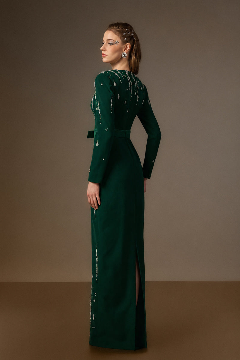 Dark green I.H.F Seraphina gown with V-neck, column silhouette, embellished flowing water effect in crepe fabric.