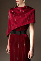 I.H.F red metallic asymmetric cape gown with round neck and sleek silhouette, featuring strip silk fabric for an elegant evening look.
