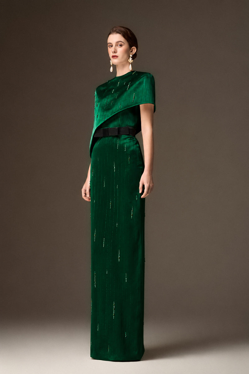 Dark green metallic asymmetric cape gown by I.H.F featuring a round neck and silk fabric, elegant and stylish evening wear.