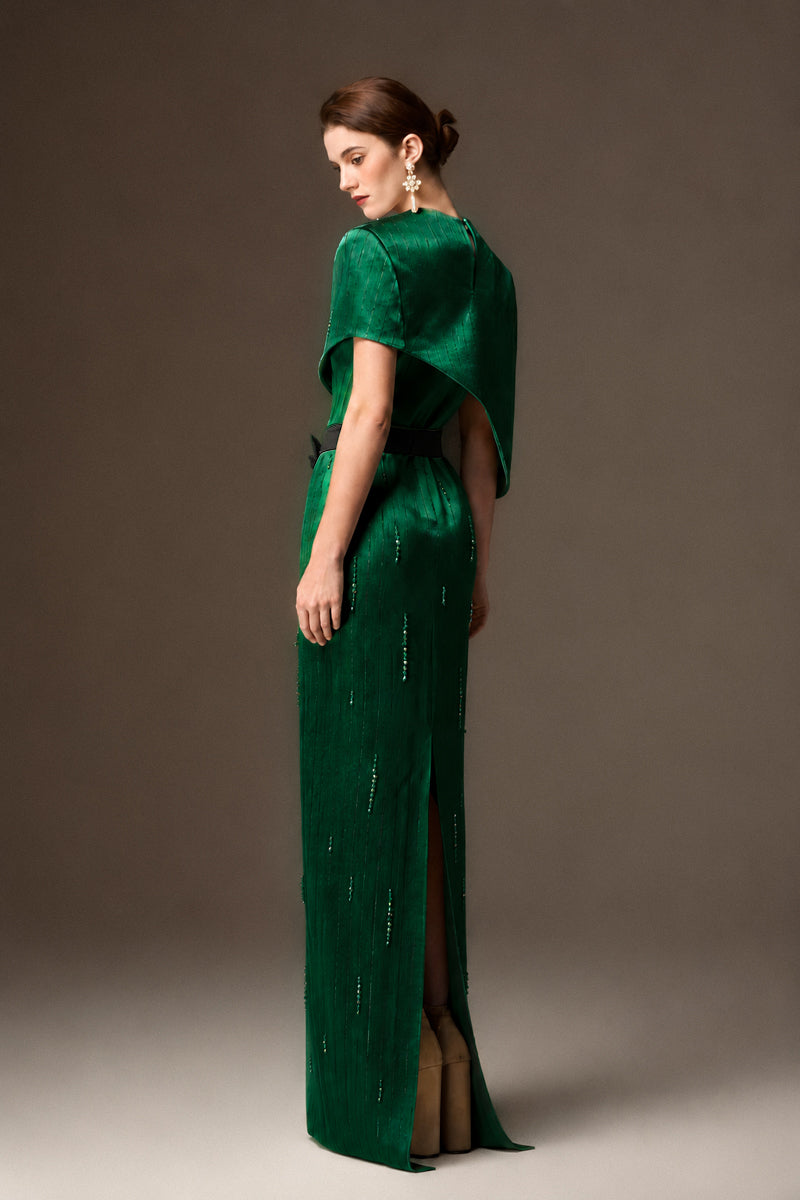 Valentina dark green metallic asymmetric cape gown by I.H.F, featuring a round neck and elegant silken striped fabric.