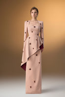 Beige crepe trapeze-neck tie dress with diagonal hip drape, designed by I.H.F, shown on a model in an elegant gown style.