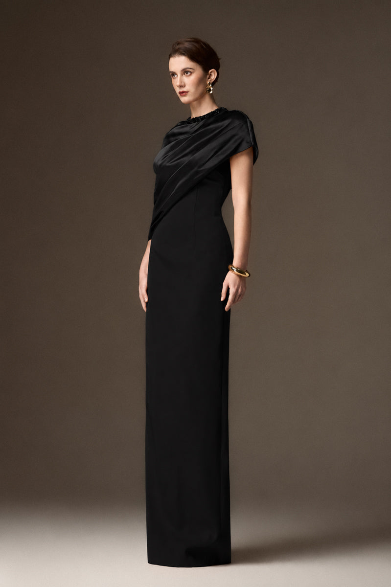 Black satin silk and crepe asymmetrical cape gown by I.H.F, featuring a round neckline and elegant silhouette.