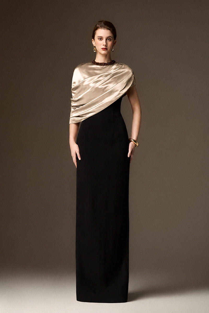 I.H.F Aurelia black and white asymmetric cape column gown in beige satin silk and black crepe with a round neck.