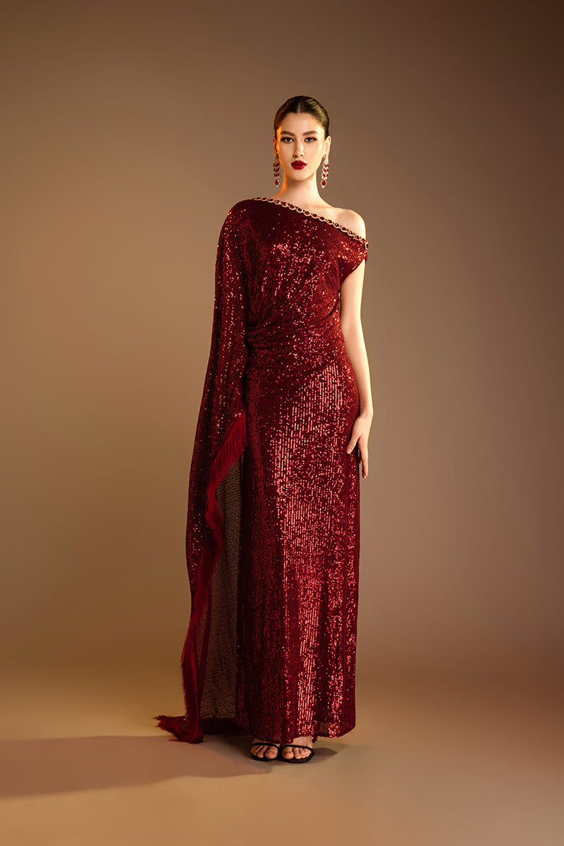 Red Valenciani one-shoulder draped sequin gown showing elegant neckline and shimmering fabric for formal occasions.
