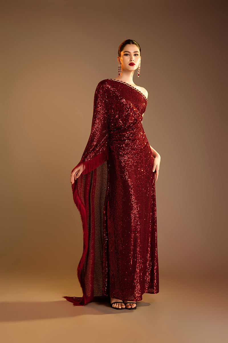 Red Valenciani one-shoulder draped sequin gown with elegant design and shimmering embellishments.