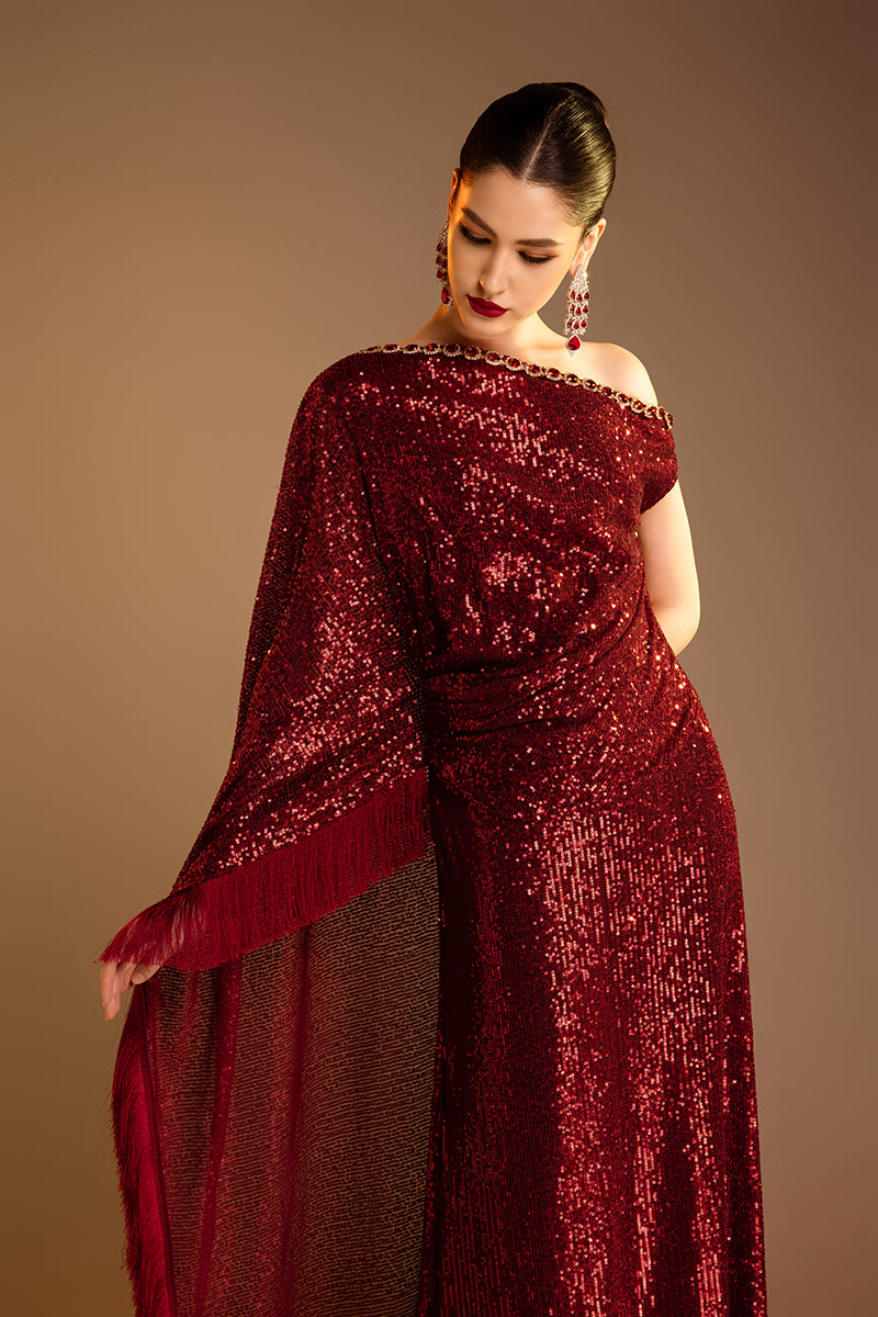 Red Valenciani one-shoulder draped sequin gown featuring elegant design and sparkling embellishments for formal occasions.