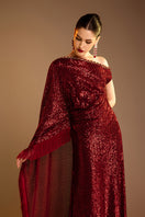 Red Valenciani one-shoulder draped sequin gown with elegant design, featuring shimmering sequins and a stylish asymmetrical silhouette.