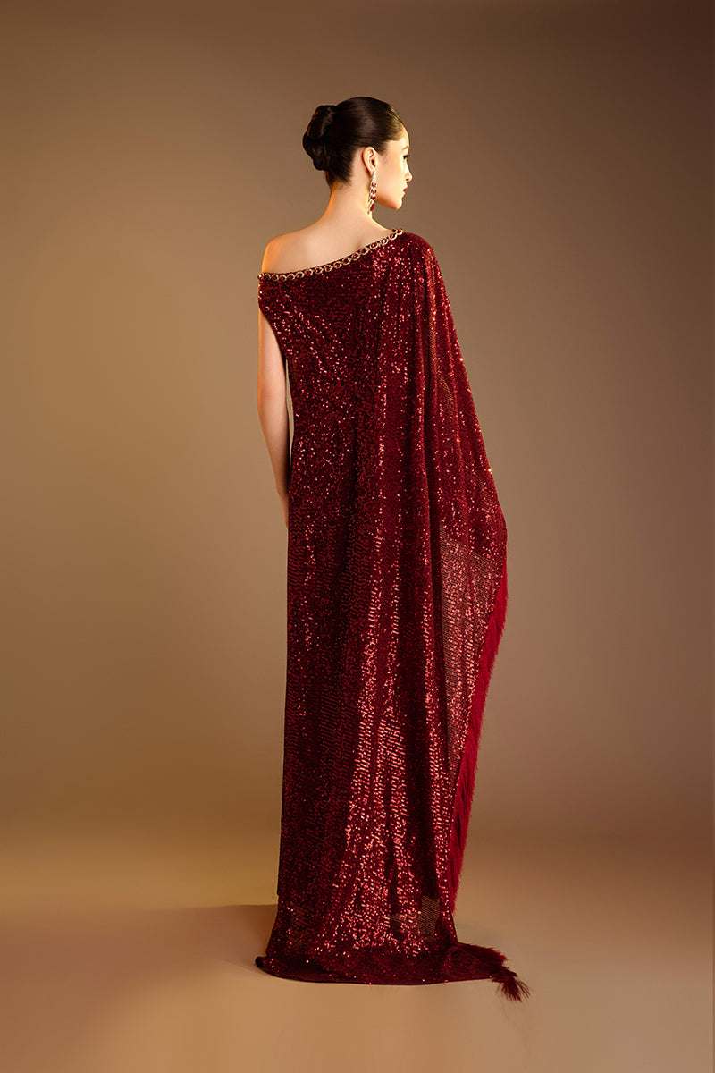Red Valenciani one-shoulder draped sequin gown with elegant design and shimmering embellishments.