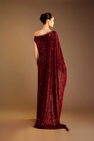 Red Valenciani one-shoulder draped sequin gown with elegant design, featuring a flowing silhouette and shimmering embellishments.
