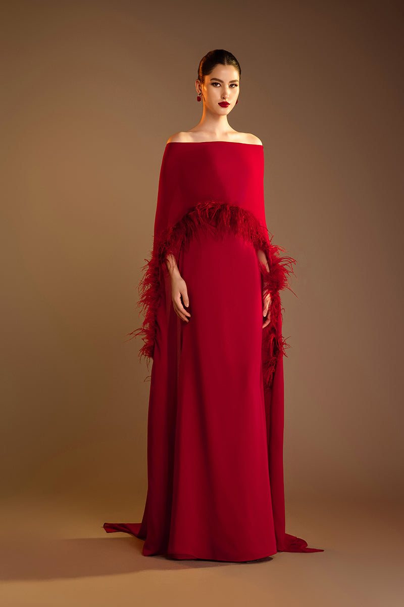 Red Valenciani ostrich feather trim cape gown, elegant evening dress with feathered accents and flowing fabric.