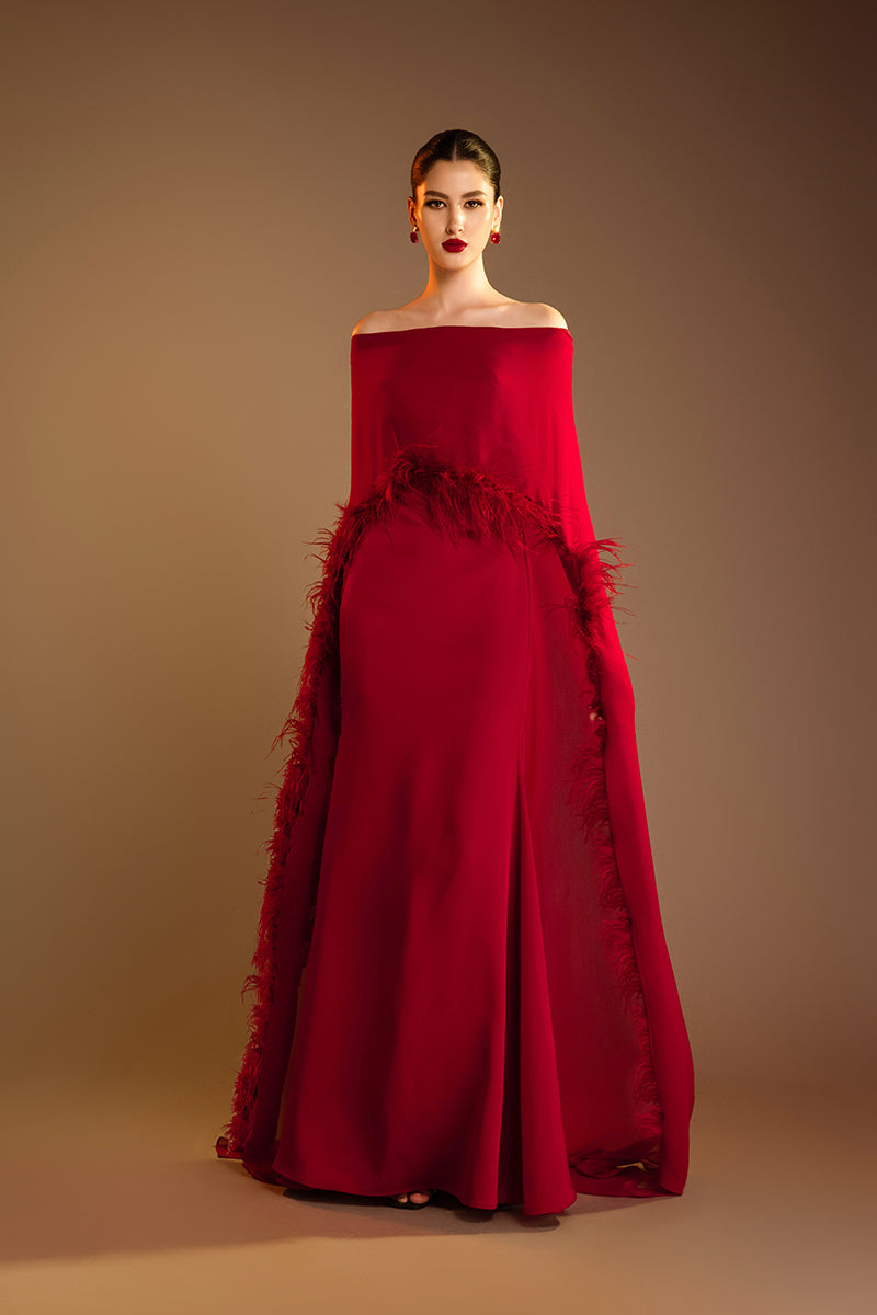 Red Valenciani ostrich feather trim cape dress, elegant gown with feather accents, displayed on a mannequin.
