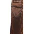 A model wearing the Aquarel Studio Lily Glitter Skirt in Mirage Brown, a stylish maxi skirt with shimmering glitter fabric.