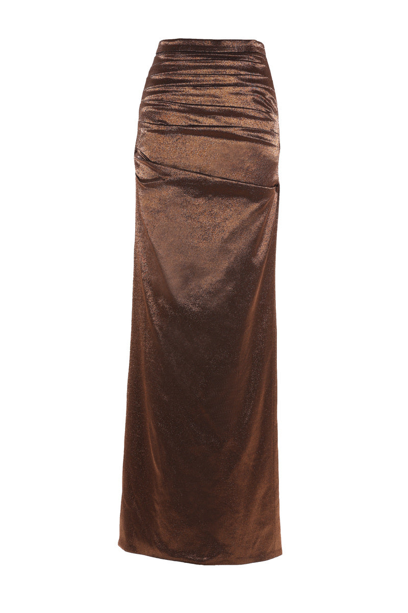 A model wearing the Aquarel Studio Lily Glitter Skirt in Mirage Brown, a stylish maxi skirt with shimmering glitter fabric.