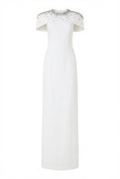 White Serra Crepe Dress by 21Six, elegant gown with flowing fabric and modern design, shown on a model.