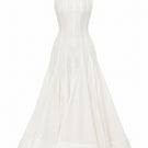 White ÉTERNA maxi dress by BY HAÓ, flowing fabric and elegant design, shown on a model in a full-length view.