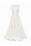 White ÉTERNA maxi dress by BY HAÓ, flowing fabric and elegant design, shown on a model in a full-length view.