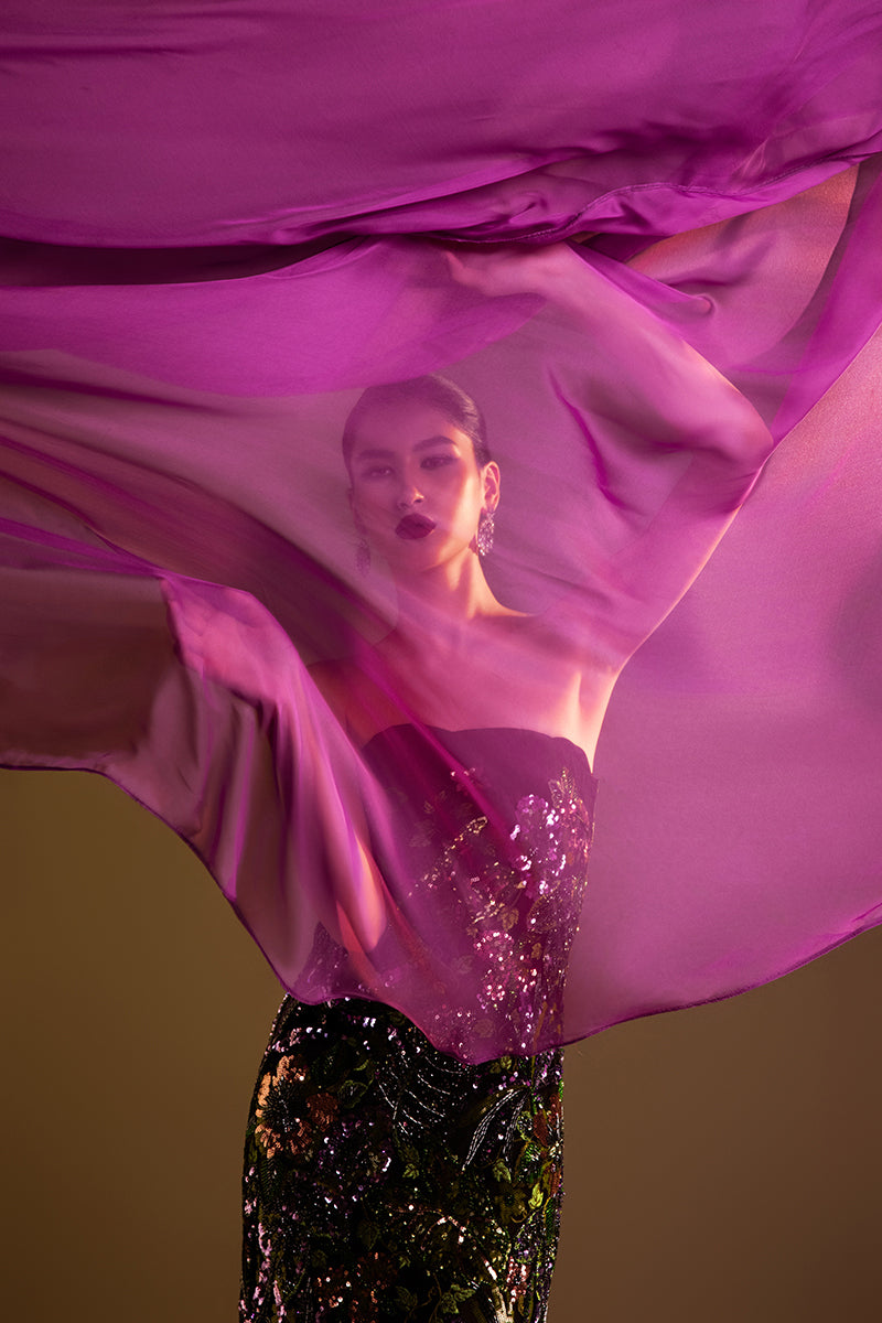 Valenciani strapless sequined gown with a long train cape, elegant evening dress with shimmering embellishments and flowing train.