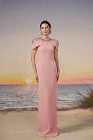 Light rose Serra Crepe Gown by 21Six featuring a flowing design, draped fabric, and elegant silhouette.