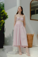 Pink gingham maxi skirt by TAGG, featuring a flowy midi length with a stylish, casual design and soft fabric.