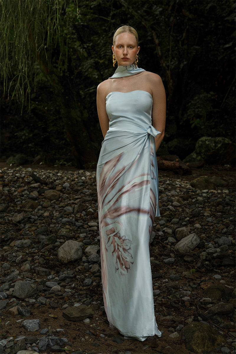 Tinta Latina Agua Maxi Skirt in celestial blue, flowing fabric with a comfortable waistband, styled for casual or dressy occasions.