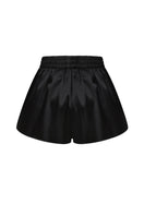 Black satin boxer shorts by ELENAREVA, featuring smooth satin fabric and a comfortable fit, shown laid flat.