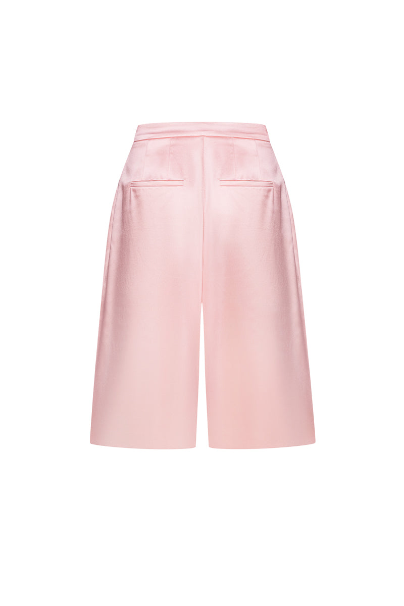 Pink satin wide-leg shorts by ELENAREVA, featuring smooth fabric and relaxed fit, displayed on a neutral background.