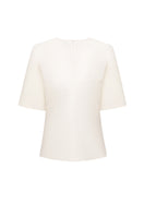 ELENAREVA geometric detail T-shirt, casual tops featuring modern geometric patterns, worn on a model with neutral background.