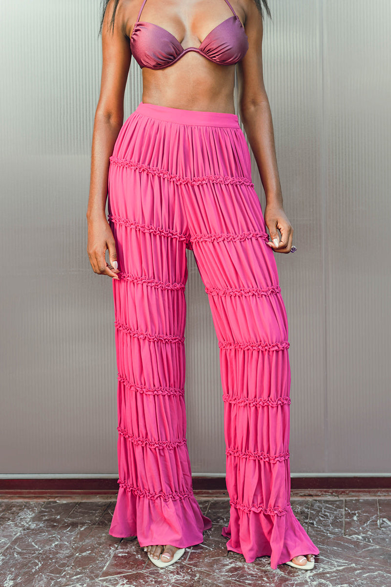 Andrea Iyamah SINA regular pants in vibrant magenta, showcasing the stylish fit and smooth fabric of these fashionable pants.