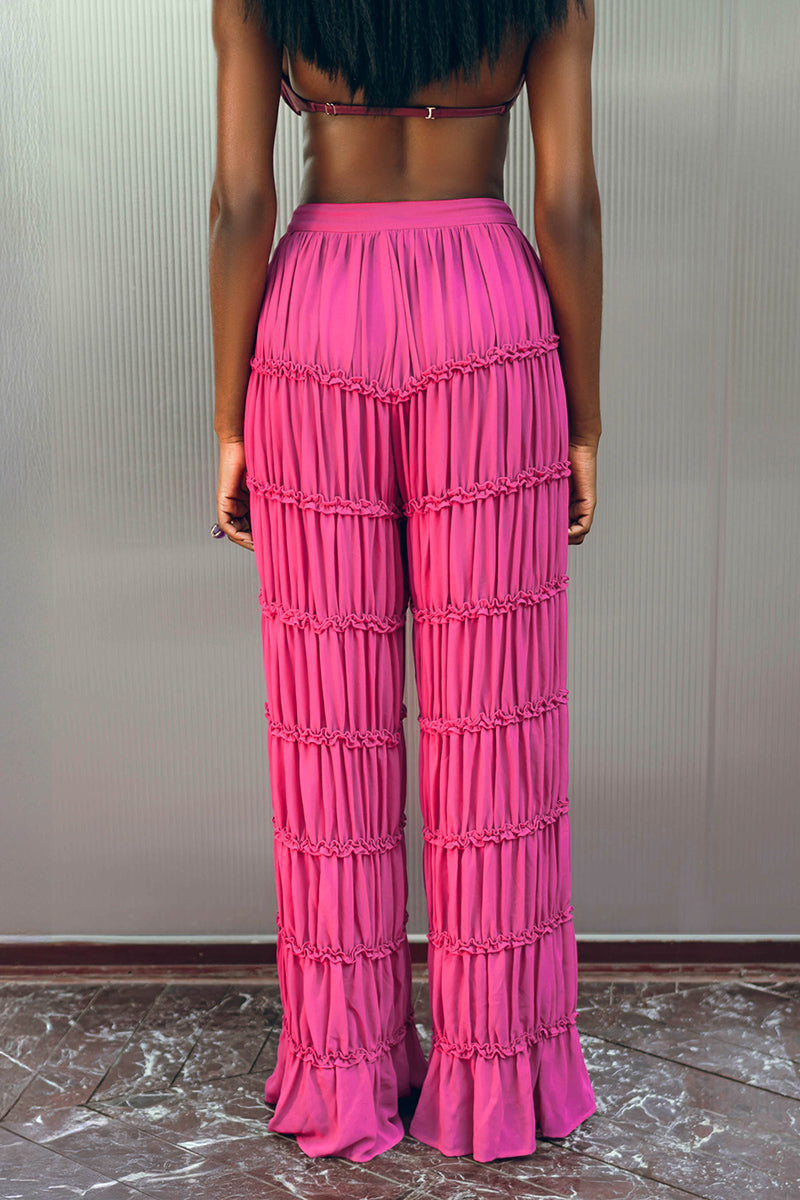 Andrea Iyamah SINA regular pants in vibrant magenta, showcasing the stylish fit and smooth fabric.