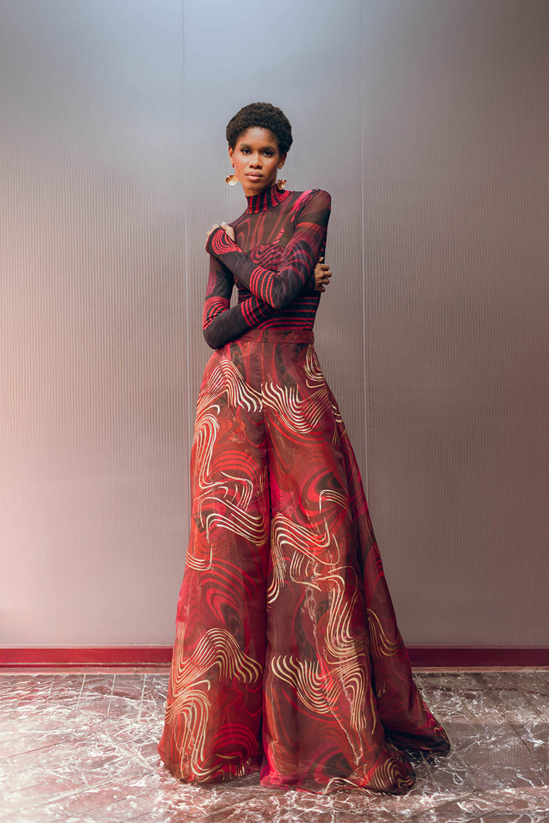 Andrea Iyamah LOMA mesh bodysuit in Corda DK print, featuring intricate mesh design and stylish cut, perfect for fashion-forward tops.