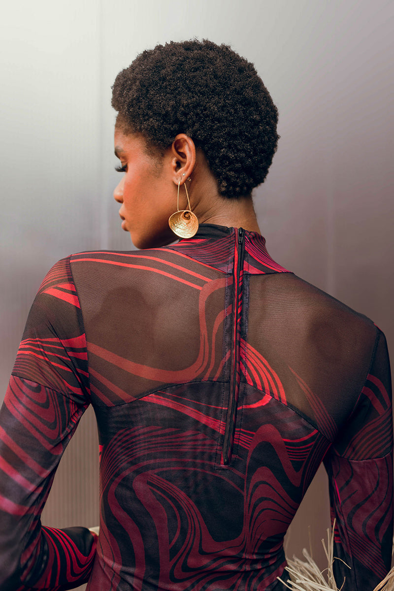 Andrea Iyamah LOMA mesh bodysuit in Corda DK print, showcasing a fitted top with intricate mesh design and vibrant pattern.