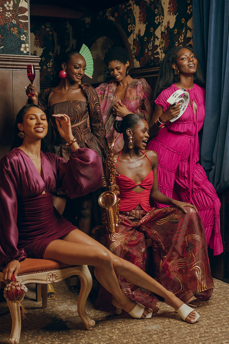 Andrea Iyamah SINA regular pants in vibrant magenta, showing the full-length, tailored design and smooth fabric.