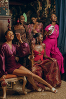 Andrea Iyamah Sina regular pants in vibrant magenta, featuring a relaxed fit and smooth fabric, shown on a model.