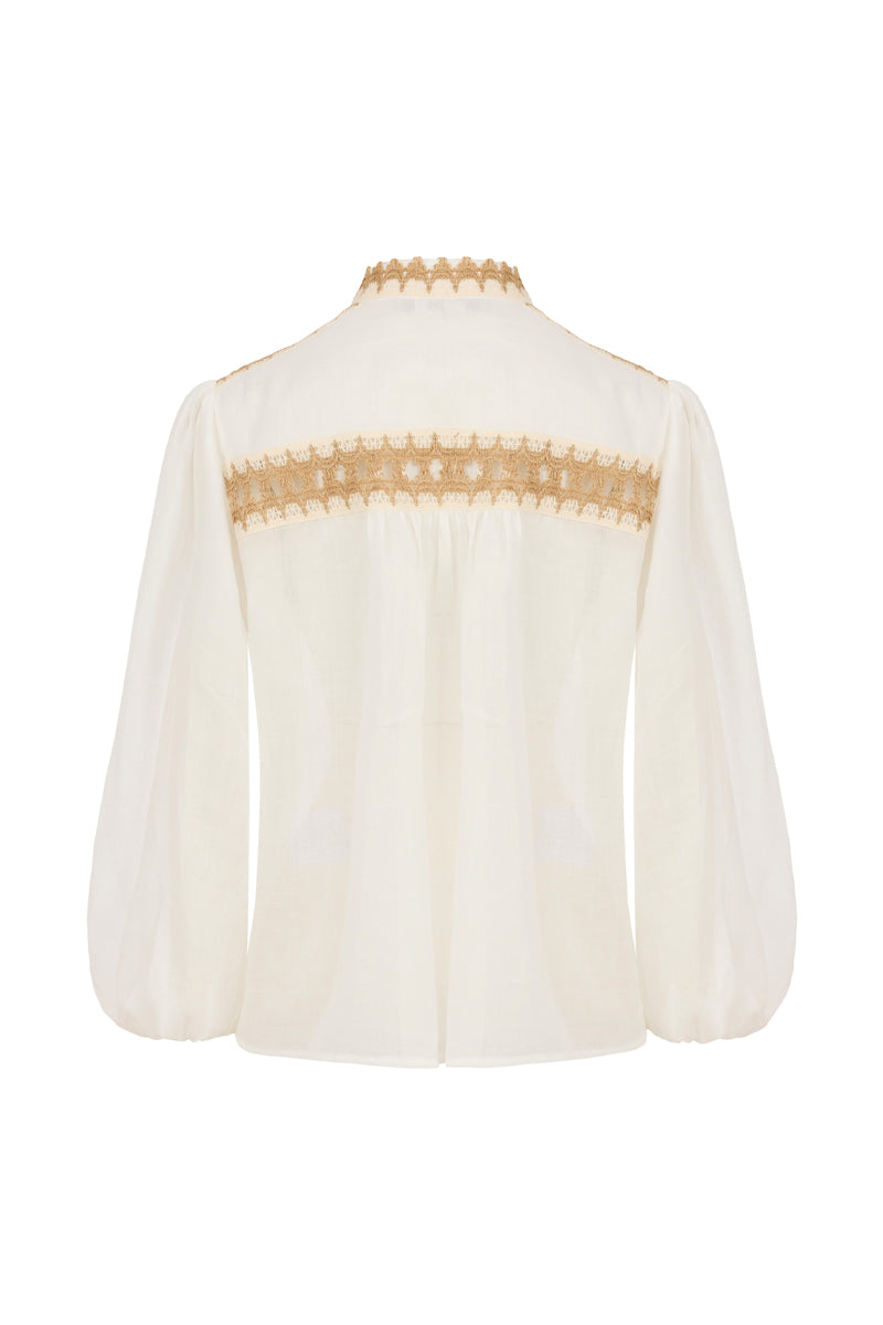 AISA Dune shirt displayed flat, showcasing its design and fabric texture, with a soft neutral color and classic collar.