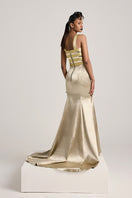 Elegant metallic gold fishtail gown by AKHL, featuring a fitted silhouette and shimmering fabric for formal occasions.