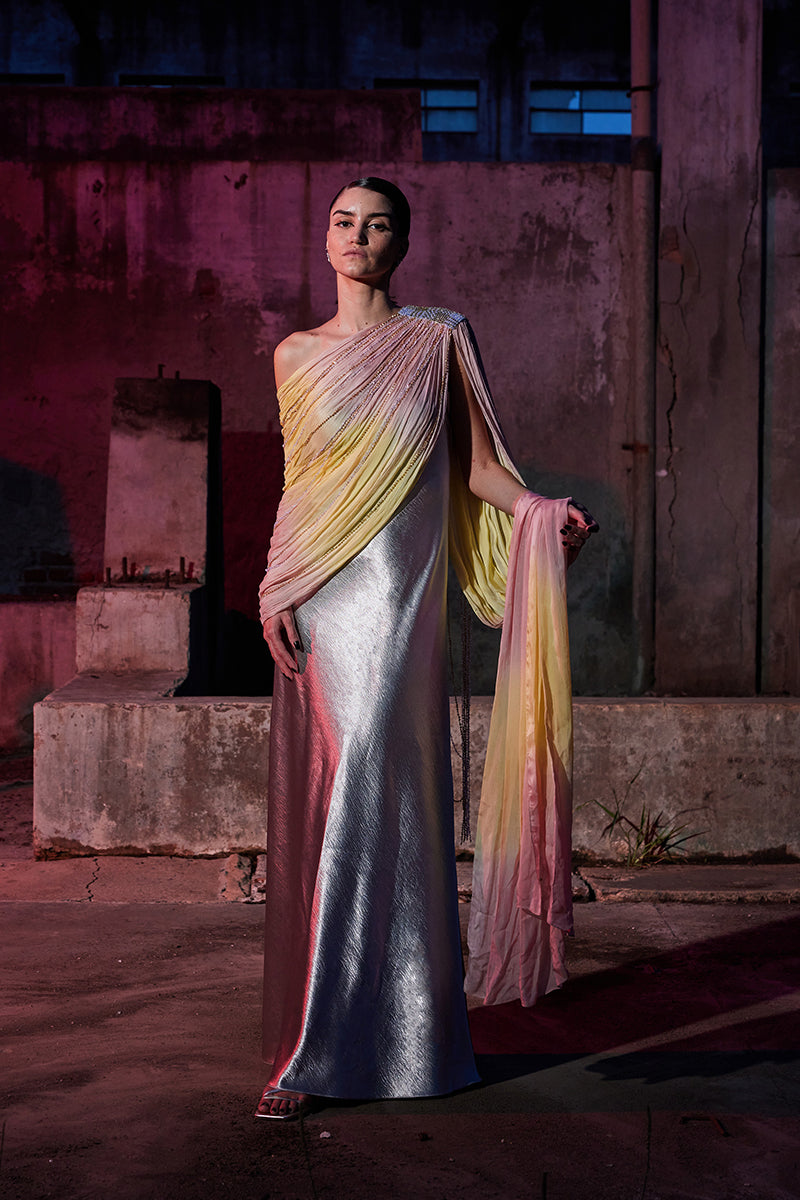 Elegant draped chiffon sequin gown by AKHL featuring flowing fabric and sparkling embellishments, perfect for formal occasions.