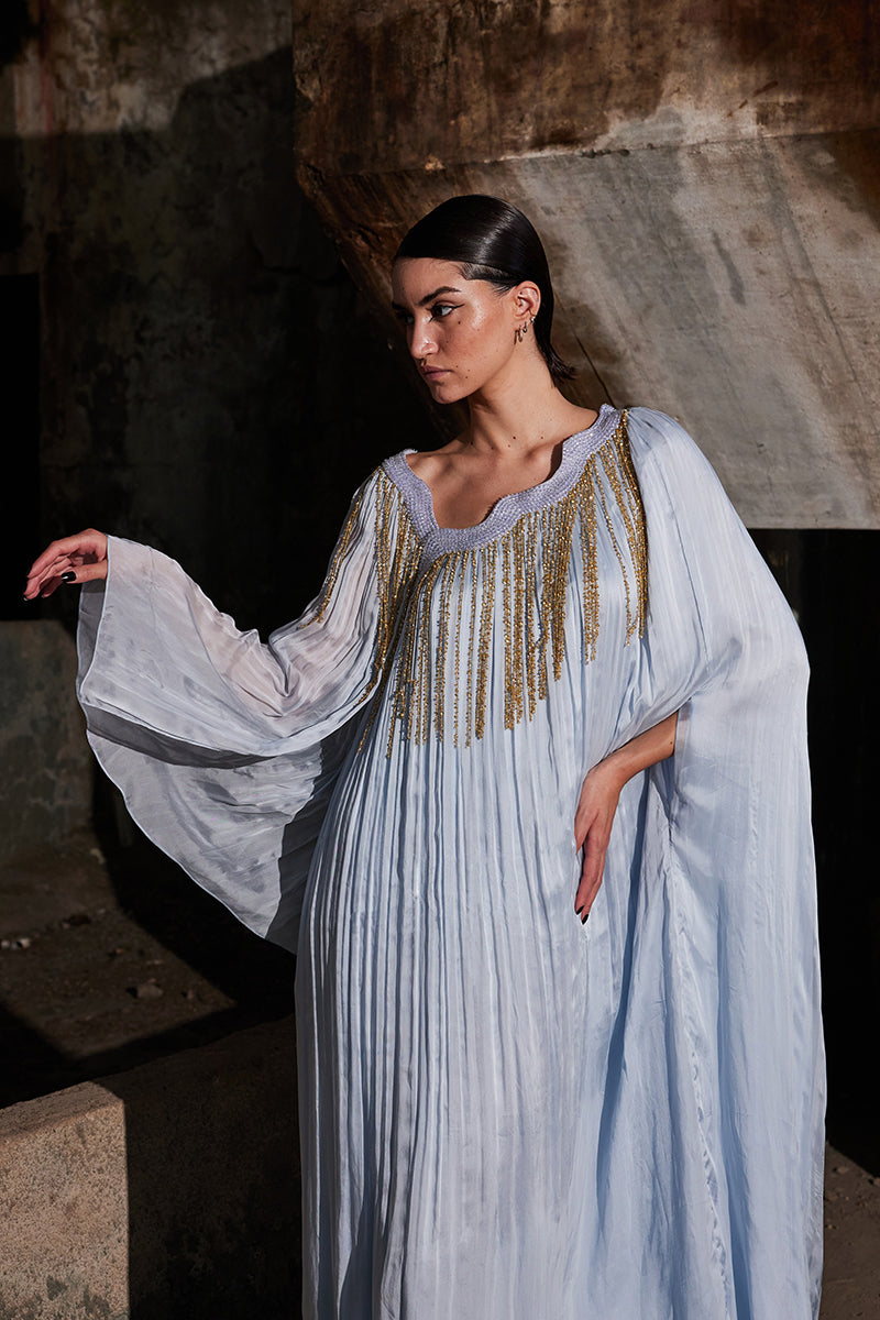 Powder blue angular gathered kaftan maxi dress by AKHL, flowing fabric with pleated detailing and relaxed fit.