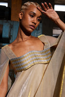Metallic gold wave bustier kaftan gown by AKHL, flowing fabric with a stylish wave design, perfect for elegant occasions.