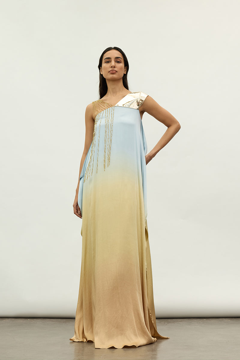 Sequin and metallic asymmetric maxi dress by AKHL featuring a shimmering design and elegant silhouette.