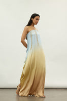Silver sequins and metallic accents on an asymmetric maxi dress by AKHL, featuring a flowing design and elegant style.