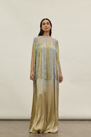 Gold and silver metallic kaftan gown by AKHL featuring shimmering fabric and elegant design, displayed on a neutral background.