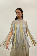 Gold and silver metallic kaftan gown by AKHL, featuring shimmering fabric and flowing design, perfect for elegant occasions.