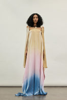 Elegant gold spectrum gown by AKHL featuring flowing fabric and intricate detailing, perfect for formal occasions.