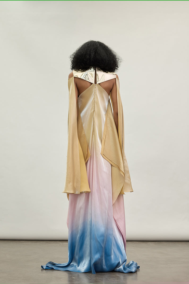 Gold Spectrum gown by AKHL featuring a flowing design with intricate detailing, perfect for elegant occasions.