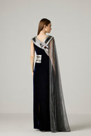 Silver metallic velvet gown by AKHL, featuring a flowing design with elegant fabric and stylish details.