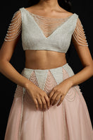 Silver sequin fringes co-ord set by AKHL, featuring a sparkling top and matching skirt with shimmering fringe details.
