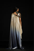 Metallic yoke asymmetric kaftan gown by AKHL featuring a shimmering metallic yoke and flowing design.