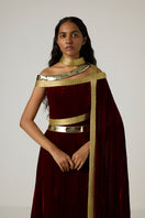 Elegant velvet metallic wrap gown by AKHL featuring a luxurious, shiny fabric and sophisticated design.